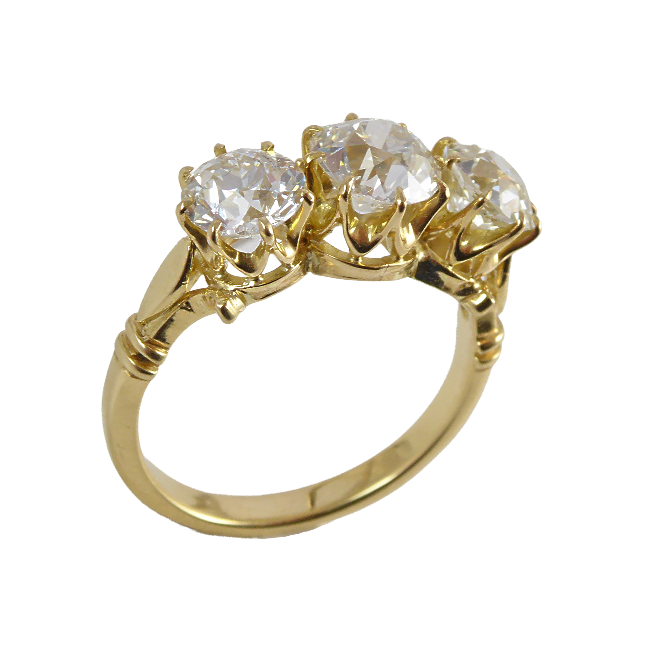 Three stone old cut diamond ring, the claw set old European cut diamonds of approximately 1.10ct and 0.80ct to either side,